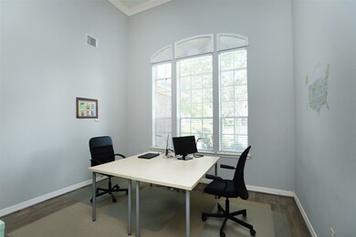 Open office with large windows.