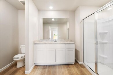 Start and end your day in style!  This ensuite bathroom boasts modern finishes, a sleek walk-in shower, and a spacious vanity with granite countertops