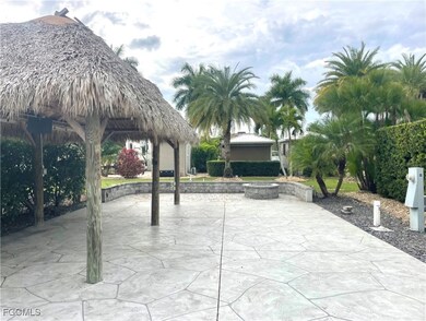 View of home's community featuring a gazebo, a patio area, and a fire pit