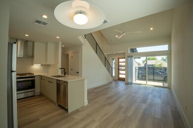 Kitchen featuring stainless steel appliances, wal