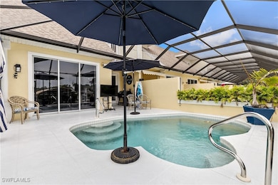 Outdoor pool featuring a patio and screen enclosur