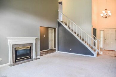 2-story great room with a fireplace.