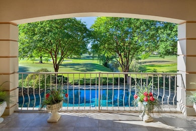 Balcony with view of pool and golf course view