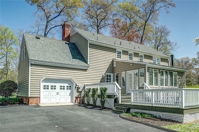 Large garage with lots of cabinets and utility sin