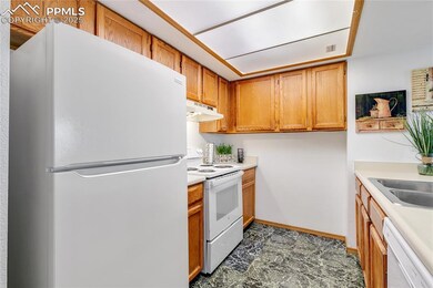 Kitchen with sink and white appliances