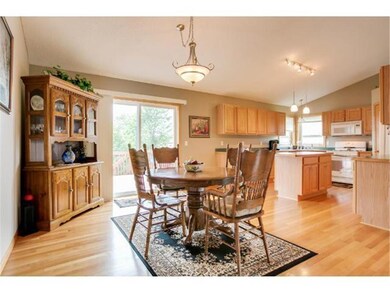 Dining area walks out to deck with stairs leading 