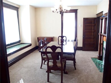 An additional fireplace and built ins in the dinin