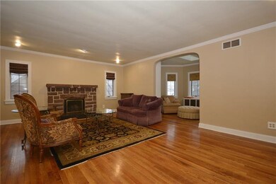 Expansive living room off the main entry with gas 