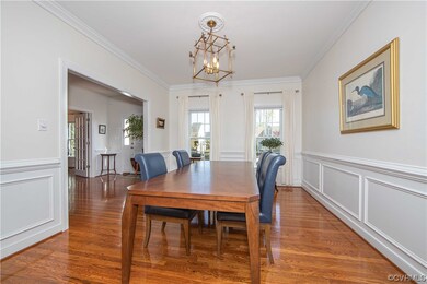 Large and spacious formal dining room with hardwoo