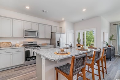 Kitchen featuring appliances with stainless steel 