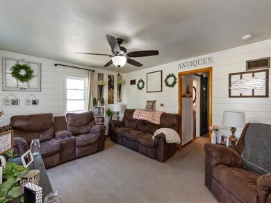 Ship lap adorns the living room walls making it ve