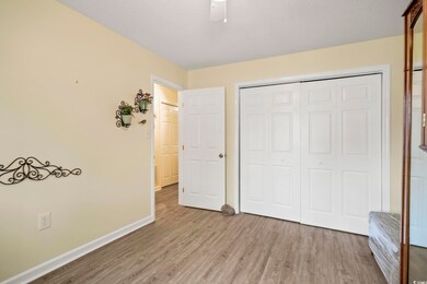 Unfurnished bedroom with a closet and wood-type fl