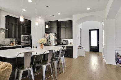 View from kitchen to front of home. Open and spacious downstairs living.