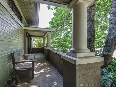 Porch. South of front door.