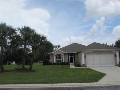 Beautifully landscaped lot shows the house well.
