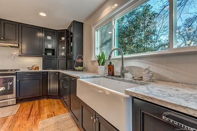 Farmhouse sink, appliance garages, gorgeous honed 