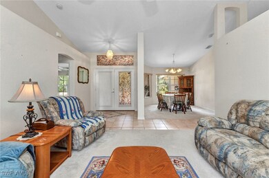 Carpeted living room with plenty of natural light,