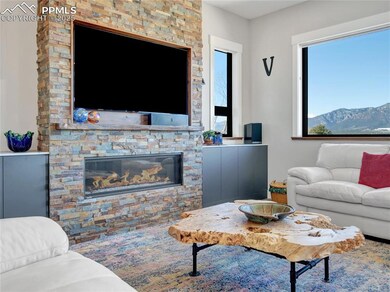 Living area featuring a stone fireplace