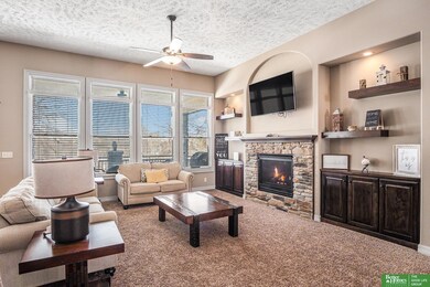 Cozy fireplace, tons of light, built ins and floating shelves