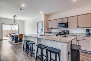 open- concept kitchen and dining room with a large
