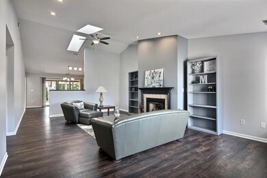 Beautiful Open Concept Great Room with High Vaulted Ceilings, 2 Skylights for extra natural lighting, recessed can lights & New Ceiling fan/light! All New Wood vinyl plank flooring! All newly professionally painted!
