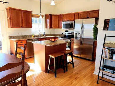 Hardwoods in hallway, kitchen, dining, and living