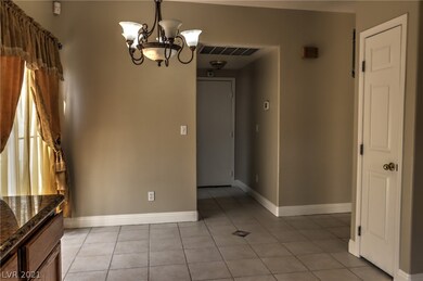 The dinette is located next to sliding glass doors
