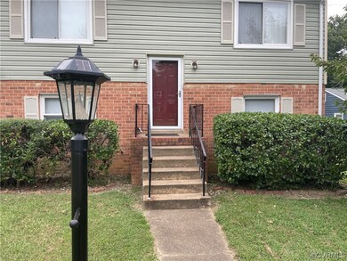Entrance to property featuring a yard