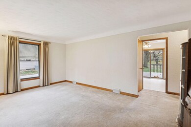 Walk in through the front door.