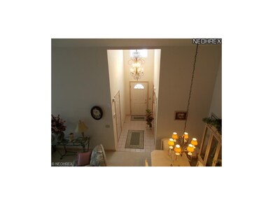 2 Story Foyer Entrance with Ceramic Tile Flooring 