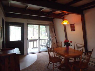 Dining facing rear of home onto the deck and slide