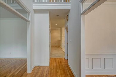 Enter to a lovely 2 story foyer with chandelier, g
