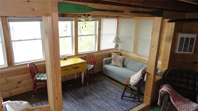 Enclosed porch overlooking Webber Pond