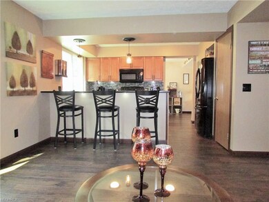 A breakfast bar bridges the family room and kitche