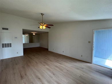 View towards the dining room, primary suite to the