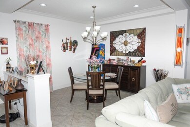Dining room with coffered ceiling and recessed lig