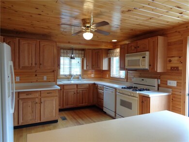 Beautiful Kitchen with wood floor to ceiling!! Tru
