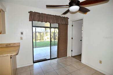 Looking out to Screened Lanai/Backyard and Kitchen