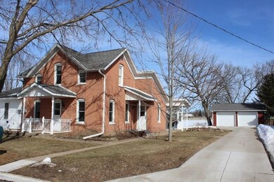 Garage with concrete patio on the north side.