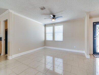 Tiled empty room with a textured ceiling, ceiling 