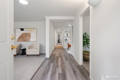 Entry Hall with living rooms on either side - Virtually Staged to Provide Sense of Uses