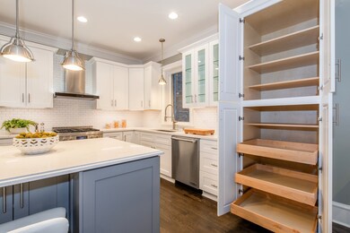 Custom cabinetry features soft-close drawers and p