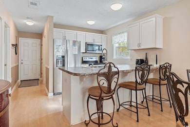 Kitchen featuring light wood finished floors, a ki