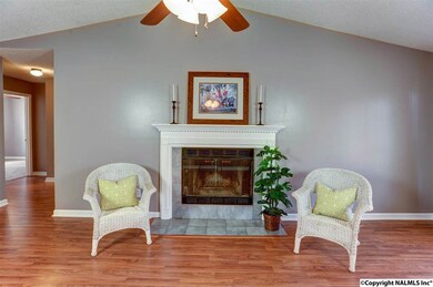 Enjoy the heat or just the ambiance of this lovely fireplace with attractive mantle.