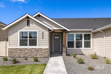 View of front facade featuring stone siding