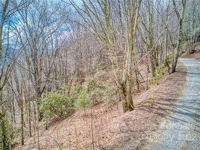 Short gravel road to property located to left here.