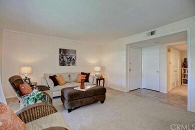 Living room entry with coat closet and tile entry,