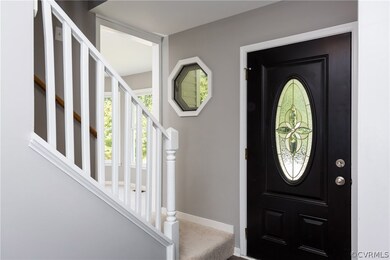 Entry with beautiful front door and octagon window