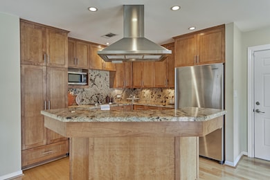 Unique, pentagon island with breakfast bar seating
