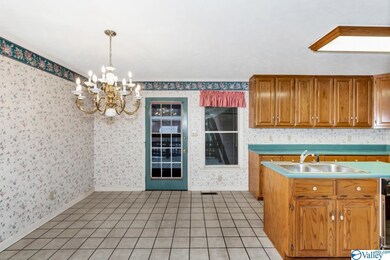 With crown molding and tile flooring.